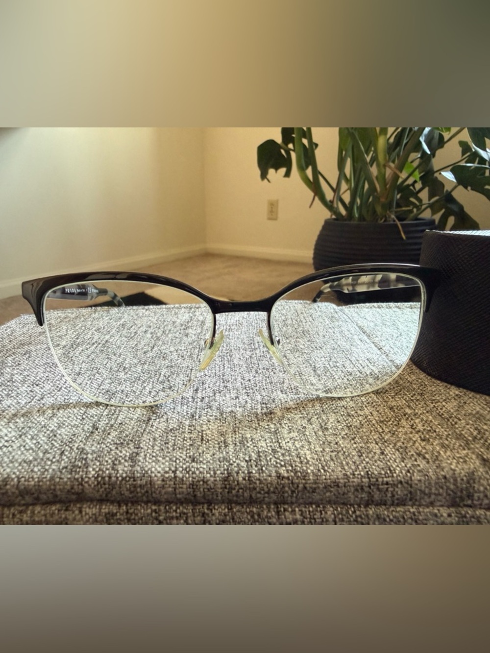 Prada Black Semi-Rimless Glasses with animal print arms